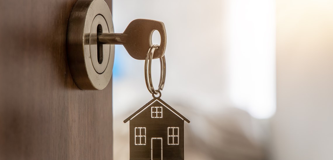 new-home-key-in-door-new-build-house