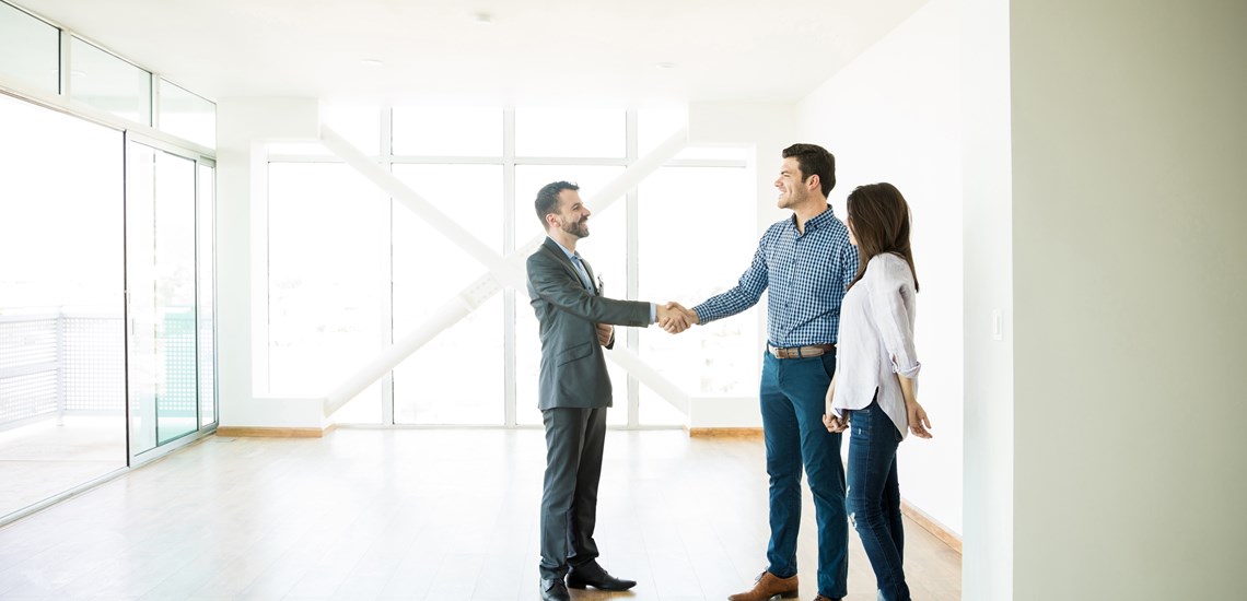 Shaking hands with couple